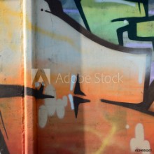 Image de Fragment of graffiti drawings The old wall decorated with paint stains in the style of street art culture Colored background texture in warm tones